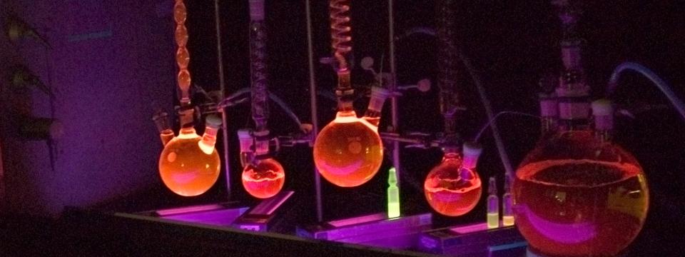 glowing connected flasks